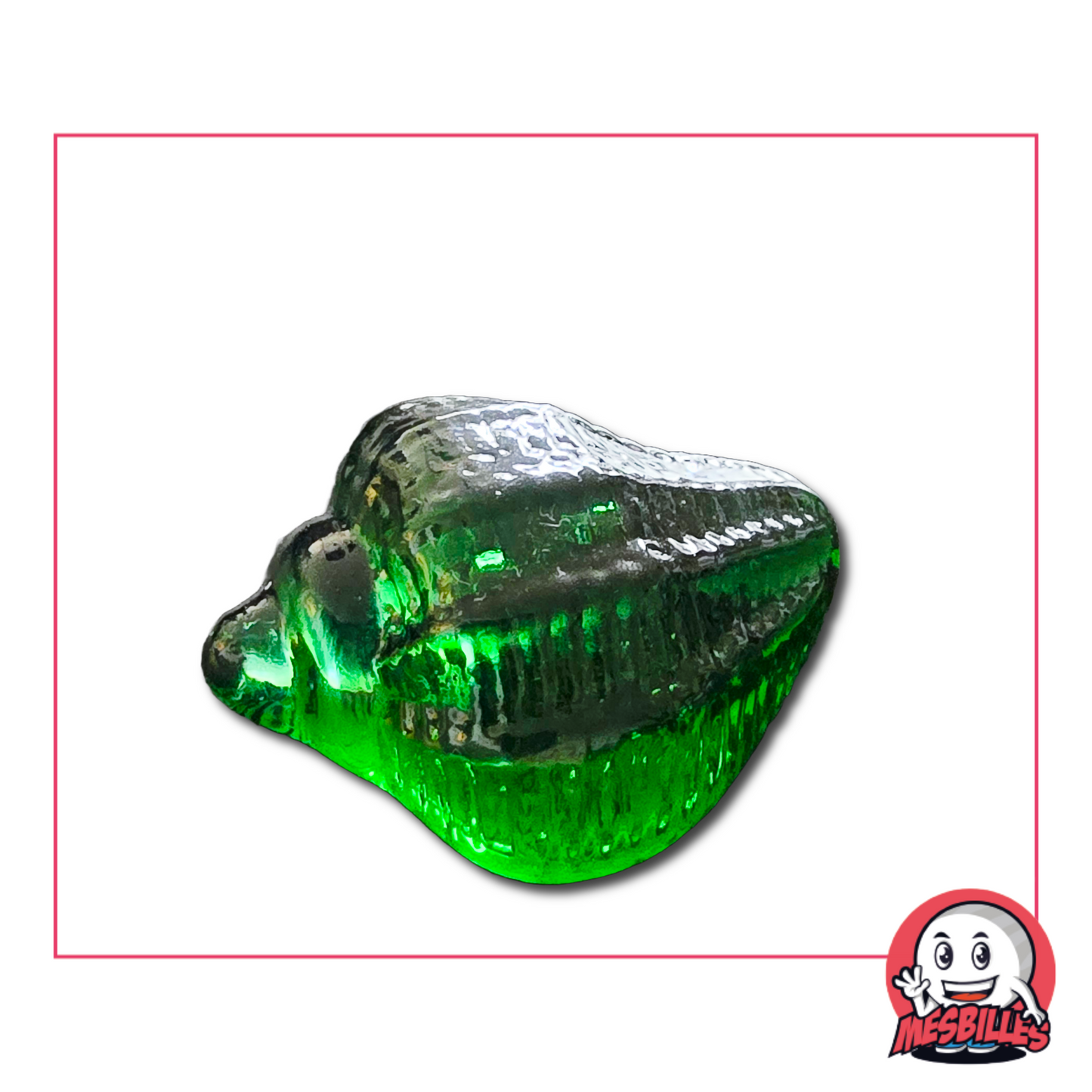 Foto de una canica verde translúcida con forma de caracol marino, 5 cm, vendida por unidades en la tienda MisCanicas.