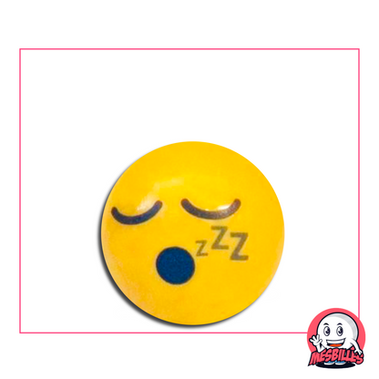 Canica amarilla con un emoticono dormido, ojos cerrados, boca abierta y el símbolo «zzz» en el lateral
