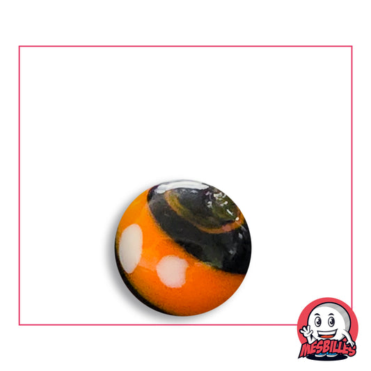 Bille Big-Bang Orange et Noir 16 mm Collector en verre orange à calotte noire et pois blancs, vue de dessus, 16 mm de diamètre