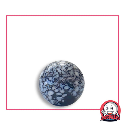 Bille Noir Mouchetée Blanc 16 mm en verre noir et blanc, vue de dessus, 16 mm de diamètre