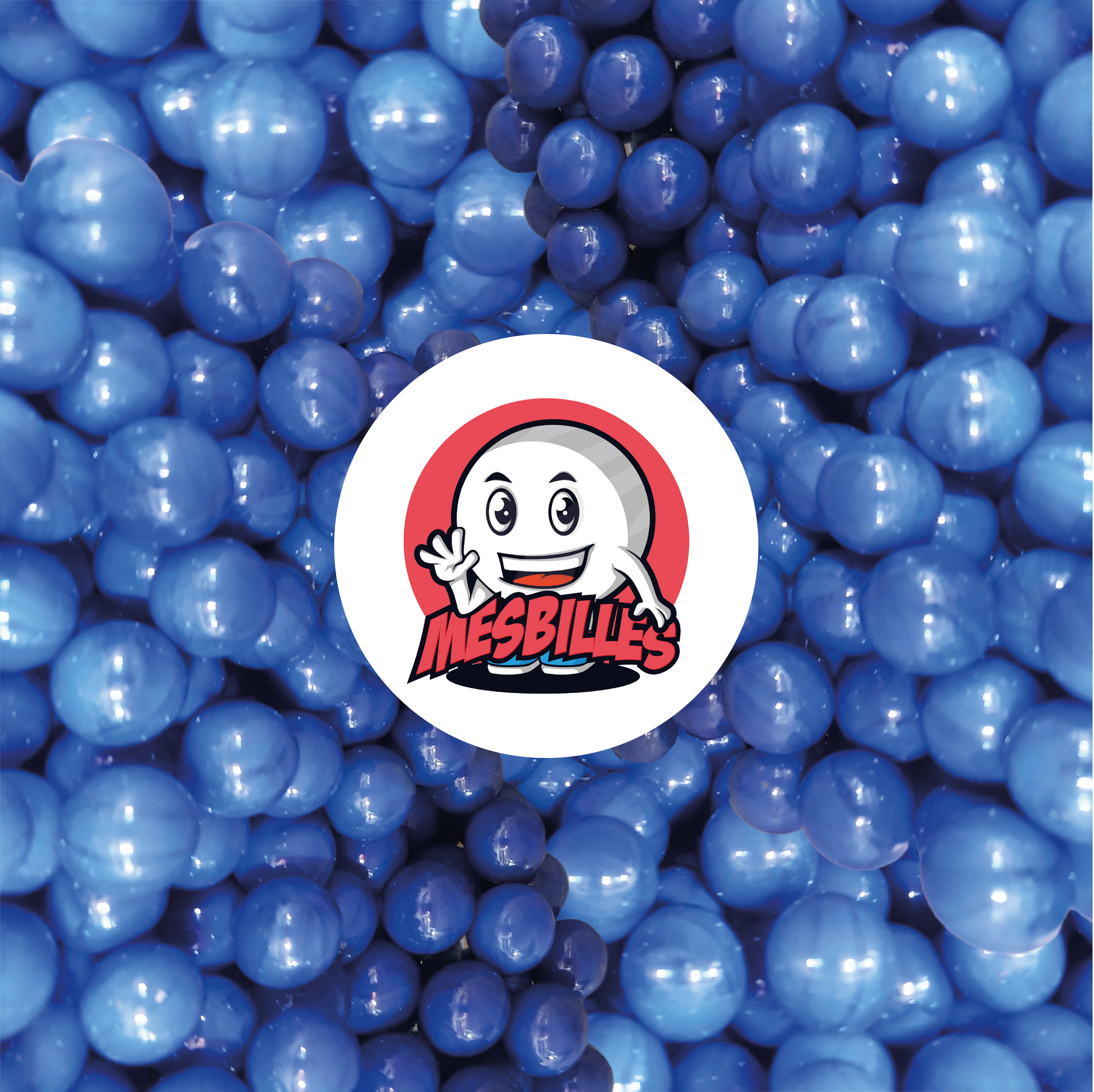 Imagen de la mascota MisCanicas rodeada de canicas opacas de 16 mm | Una oda al color azul - MisCanicas