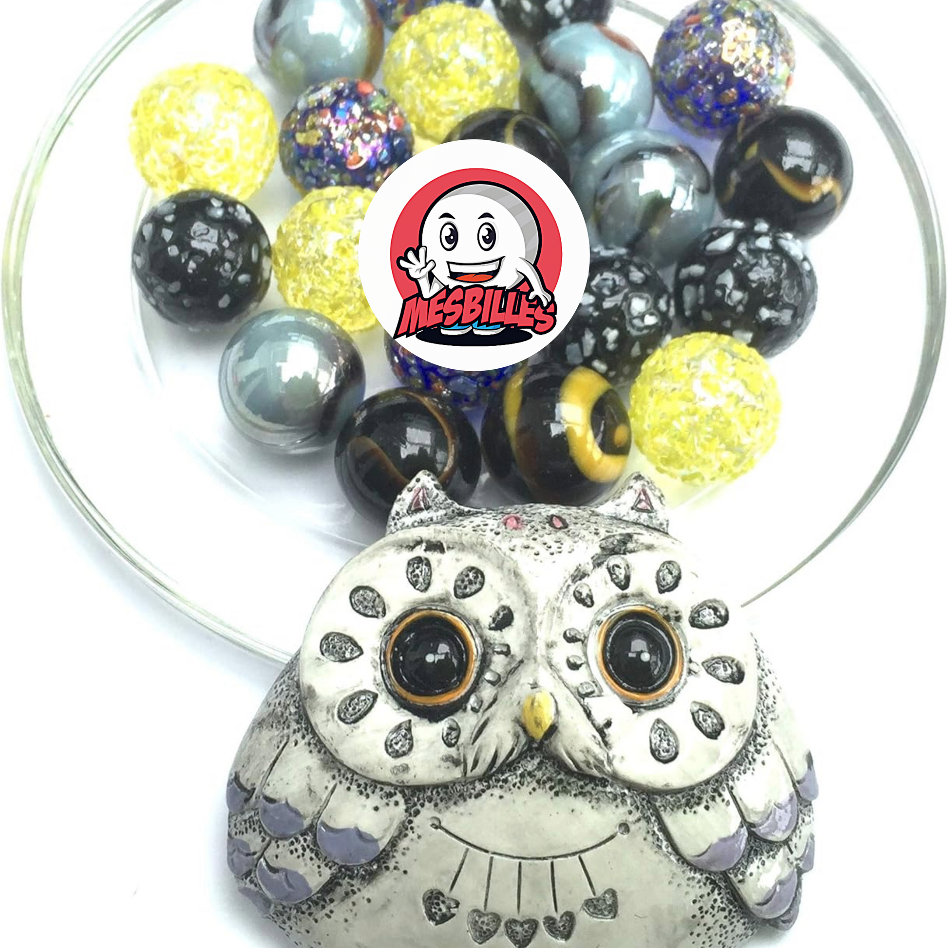 Un búho gris todo redondeado, 20 canicas de cristal brillantes - MisCanicas
